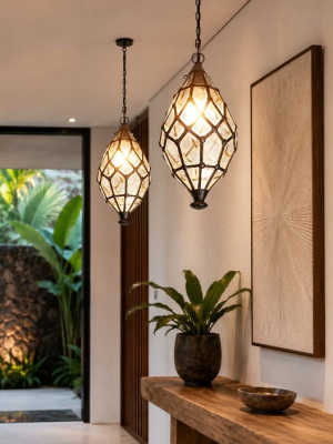 Bevelled light CPL10- from CasaPandan. A beautiful pendant light in the shape of a teardrop handcrafted by a Balinese craftsman in glass and brass.