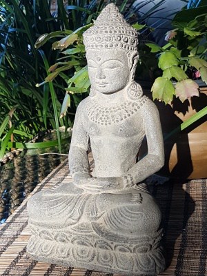 This elegant Fertile Buddha - 30x19cm CPS7 - It is handcrafted in volcanic ash and concrete by the talented Balinese craftsmen and women.