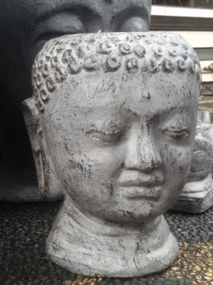 Buddha Head planter 30x25x25cm CPS75. Handcrafted in volcanic ash and concrete by our Balinese craftsmen and women for your patio or garden.