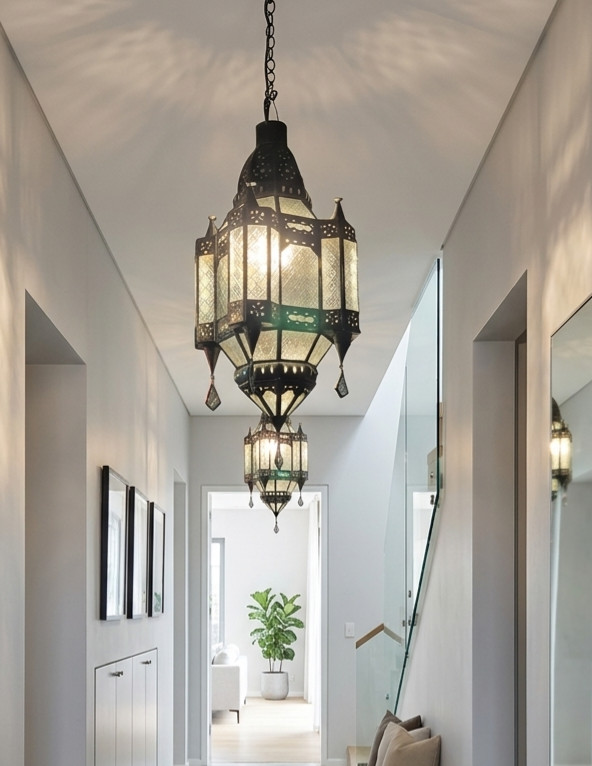 Handcrafted in Bali from glass and brass, this rust-resistant 50 x 30 cm Moroccan-style lantern brings instant warmth and character to any space.