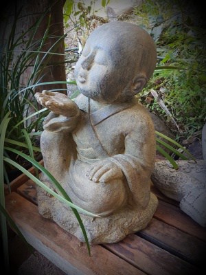 BUDDHA STATUE BLOWING 40x25cm - CPS35 - Limestone, concrete or fibre cement Statues handcrafted from Bali for interior and outdoor design.