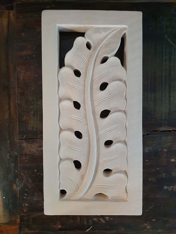 Balinese stone panel 40x20cm - Banana Leaf design CPS123 is hand carved from solid Balinese limestone. Create a Balinese theme in your home.