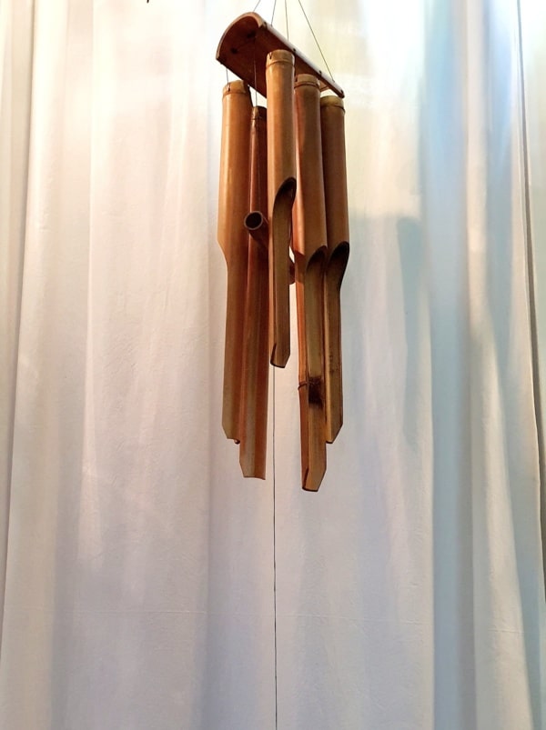 Long wind chimes CPW70 - 60cm long with a BAMBOO top are  hand carved by the creative Balinese. Add peaceful Balinese sounds in your home or garden