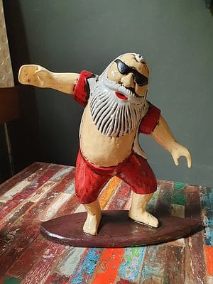 Surfing Santa CPW51 - the gift for the surfer who has everything. Handcarved and painted by the talented Balinese. ENJOY THE MOMENT