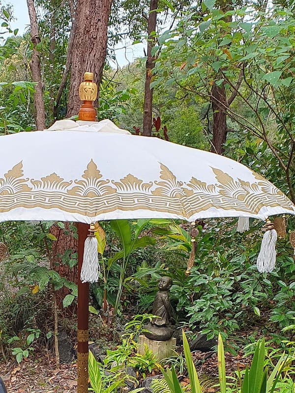 Balinese Umbrella 1.5 metre in Natural colour - Trimmed with Gold - Hearts and tassels. Our Balinese umbrellas are a stunning addition to any space.