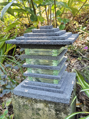 Lavastone & Glass Light - CPS202 - 30x24cm  will illuminate your garden blending natural volcanic stone with elegant glass.