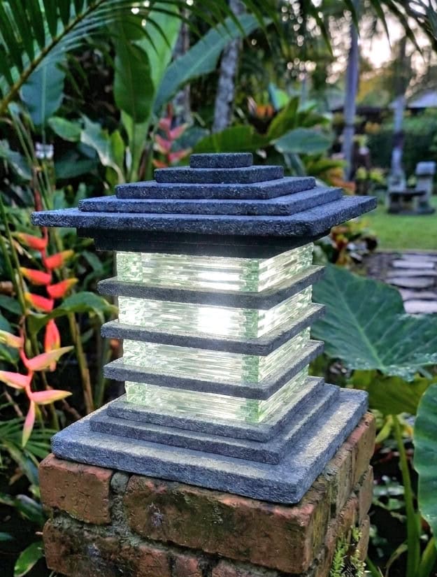 Lava Stone & Glass Light - CPS202 - 30x25cm from CasaPandan will illuminate your garden blending natural volcanic stone with elegant glass.