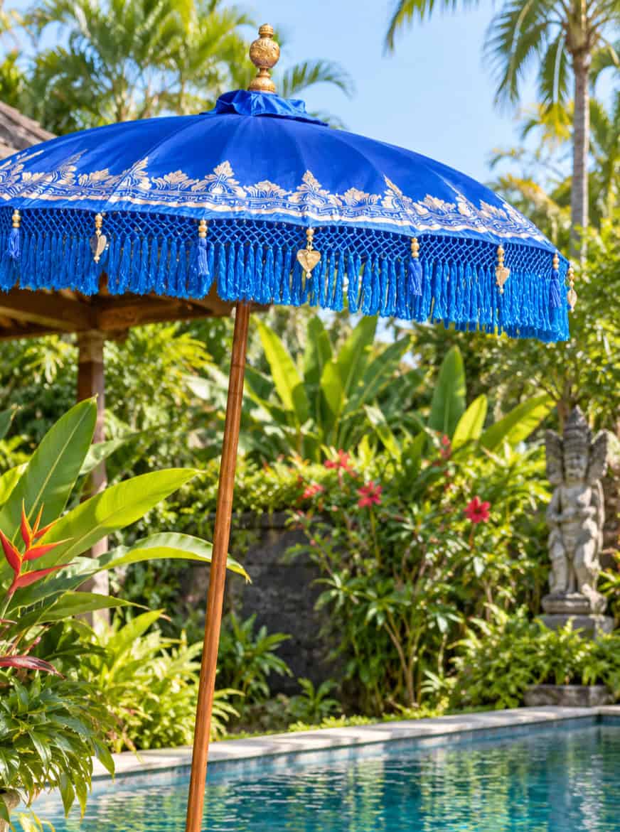 Decorated Balinese Waterproof Umbrella 2m BLUE -CPU7 in gold with hearts and tassels. Handcrafted by skilled artisans in Bali.