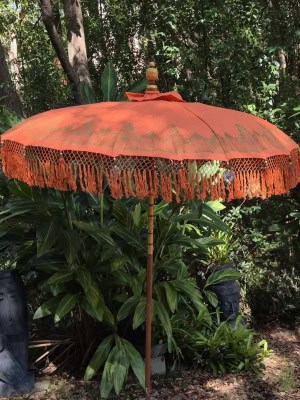 Decorated Balinese Waterproof Umbrella 2m ORANGE CPU10 in gold with hearts and tassels. Handcrafted by skilled artisans in Bali.