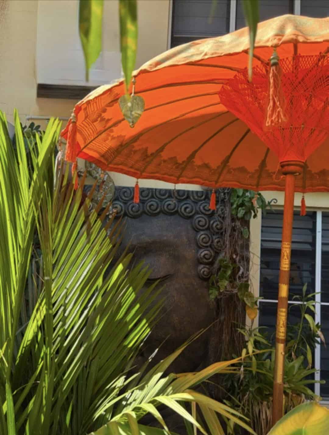 Decorated Balinese Waterproof Umbrella 2m ORANGE CPU10 in gold with hearts and tassels. Handcrafted by skilled artisans in Bali.