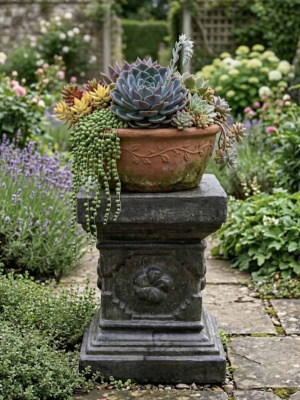 Simple, sturdy, and elegant. The Slate Grey Garden Pedestal 55cm pedestal from CasaPandan is handcrafted in Bali using Glass Reinforced Concrete (GRC).