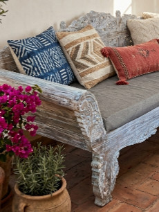 Handcrafted by skilled artisans in Bali, the Balinese Hand Carved Daybed (Whitewash) from CasaPandan features intricate floral carvings.