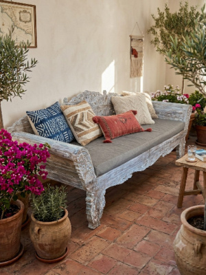 Handcrafted by skilled artisans in Bali, the Balinese Hand Carved Daybed (Whitewash) features intricate floral carvings and a relaxed, coastal aesthetic.